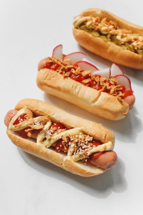 otdogs with different toppings and condiments