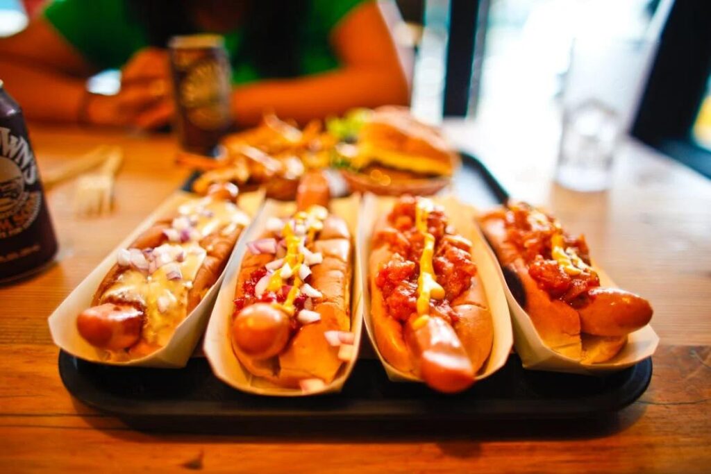 a tray of freshly loaded hot dogs