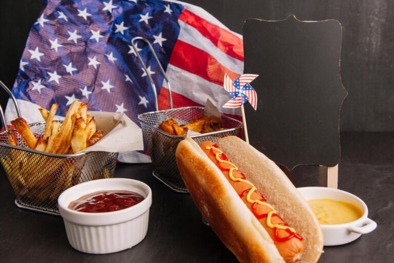 an aesthetic shot of a hotdog and condiments lines up