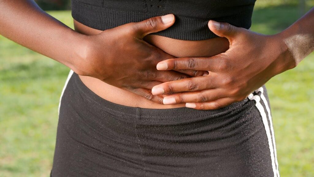 a person holding their stomach