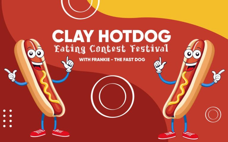 Colorful cartoon banner with two animated hot dogs promoting the Clay Hotdog Eating Contest Festival